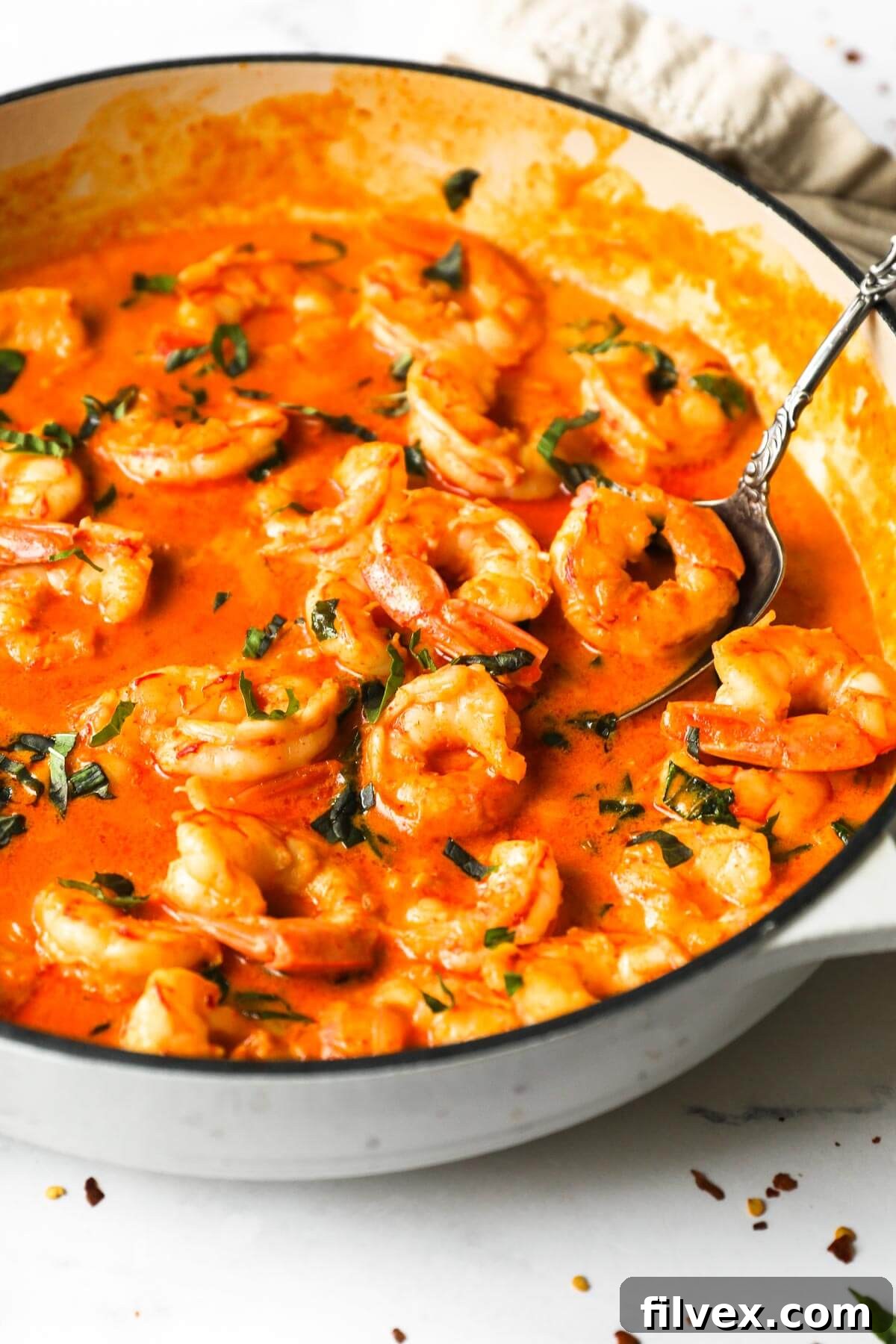 Another perspective of the delicious creamy coconut shrimp dish, highlighting its rich texture and inviting aroma.