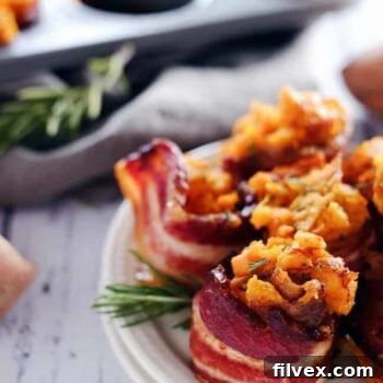 Crispy bacon cups filled with creamy mashed sweet potatoes, garlic, and rosemary.