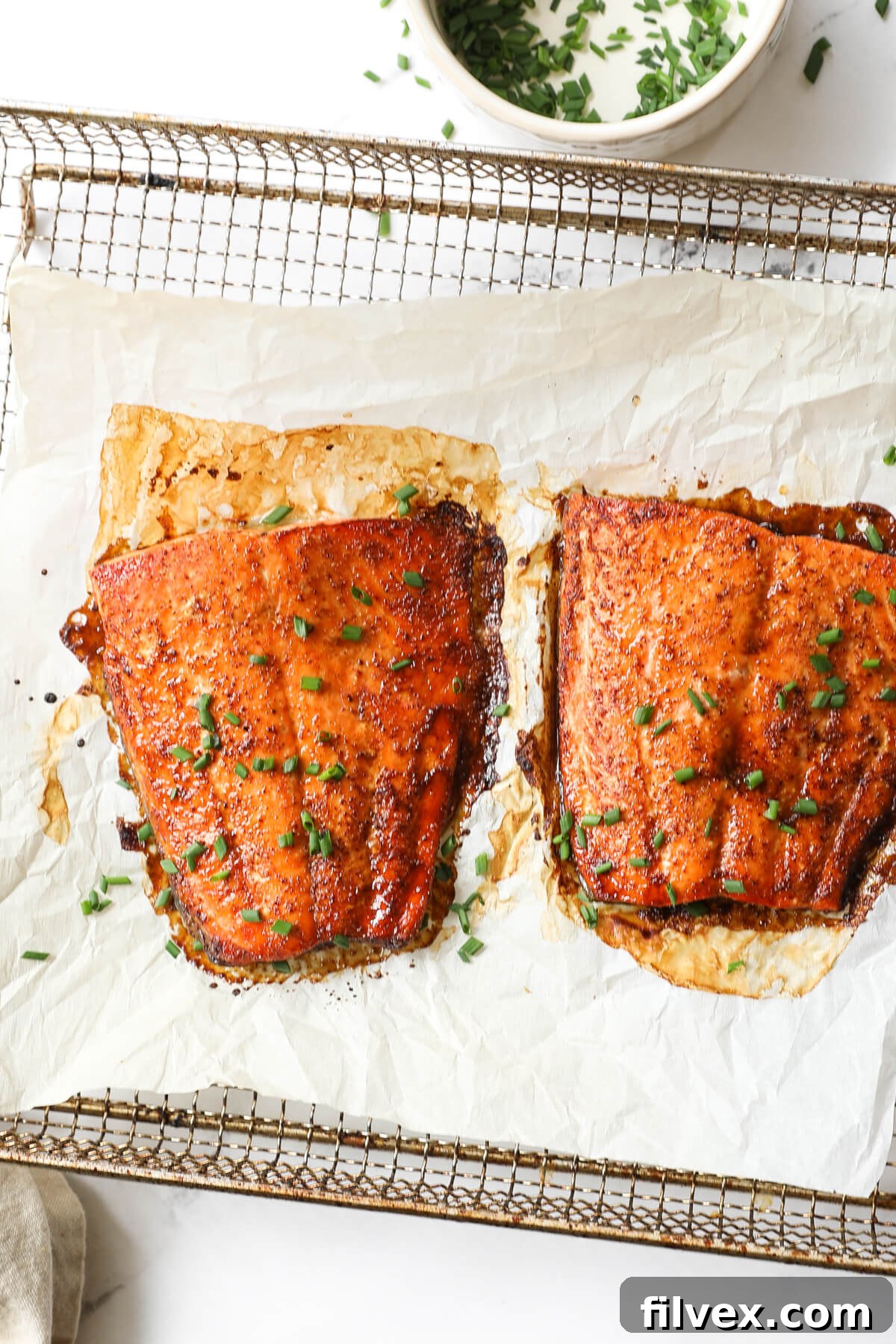 Close up overhead image of two pieces of air fried salmon.
