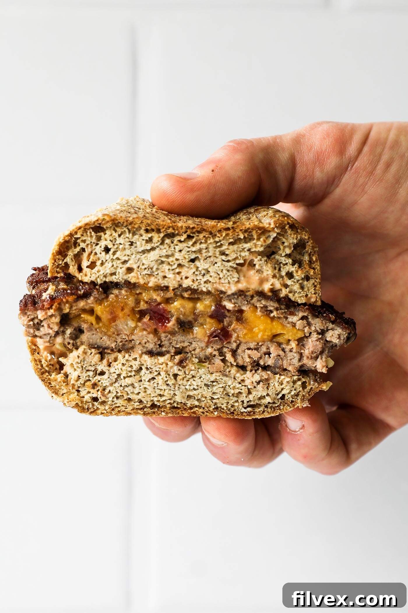 A selection of low-carb side dishes served alongside a keto stuffed burger