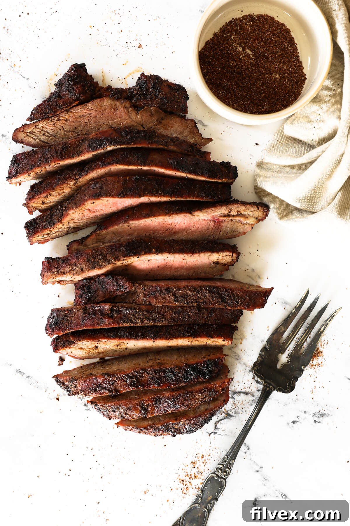 Grilled coffee-rubbed steak sizzling on the grill