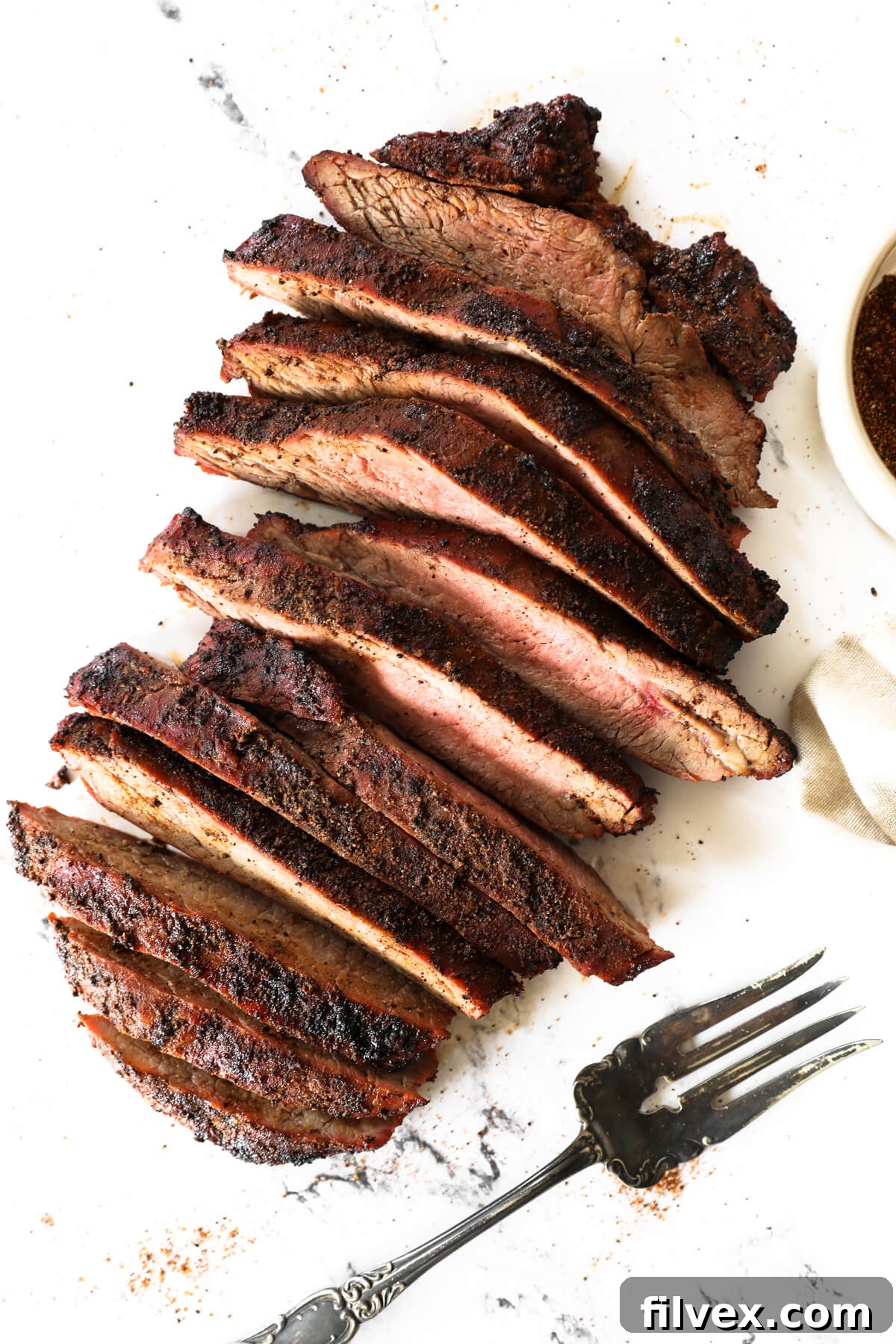 Grilled coffee-rubbed steak, sliced and ready to serve