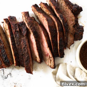 Overhead shot of sliced coffee rubbed steak on marble