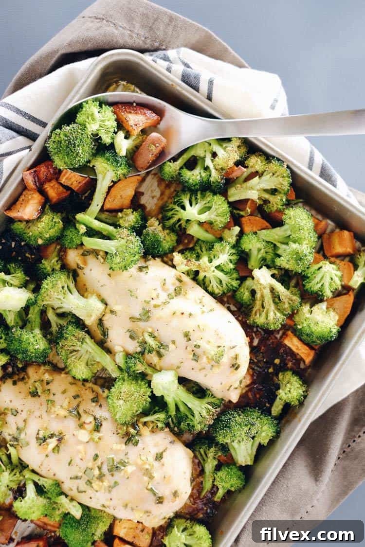 Our One-Pan Honey Garlic Chicken is an easy, healthy, and flavorful dish featuring chicken, sweet potatoes, and broccoli.