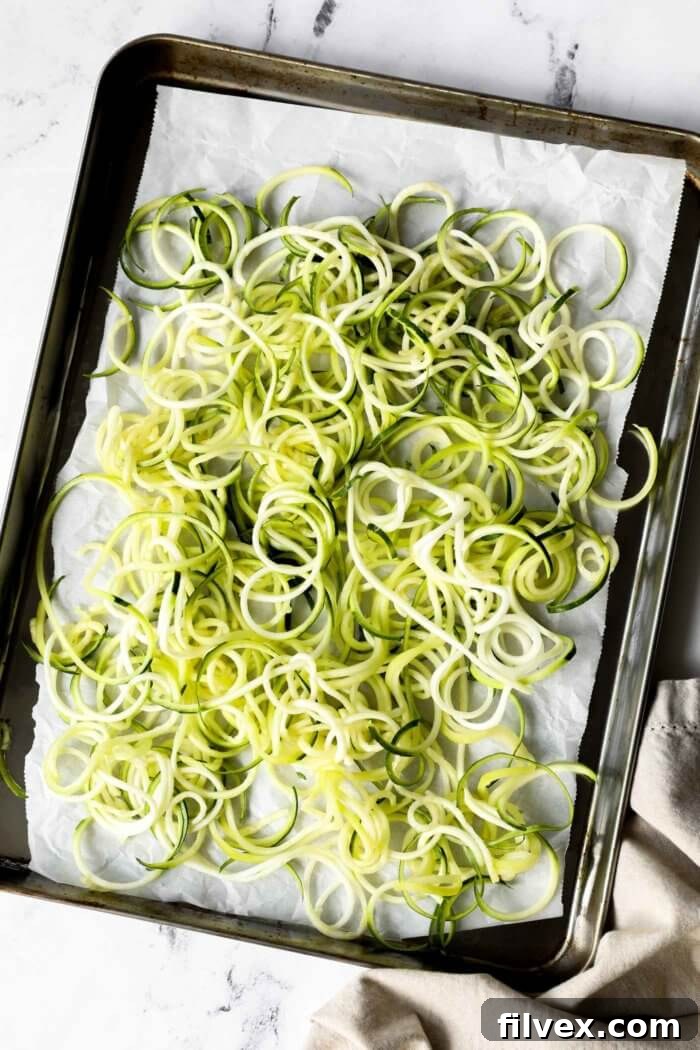 Overhead image of zoodles on a sheet pan. 