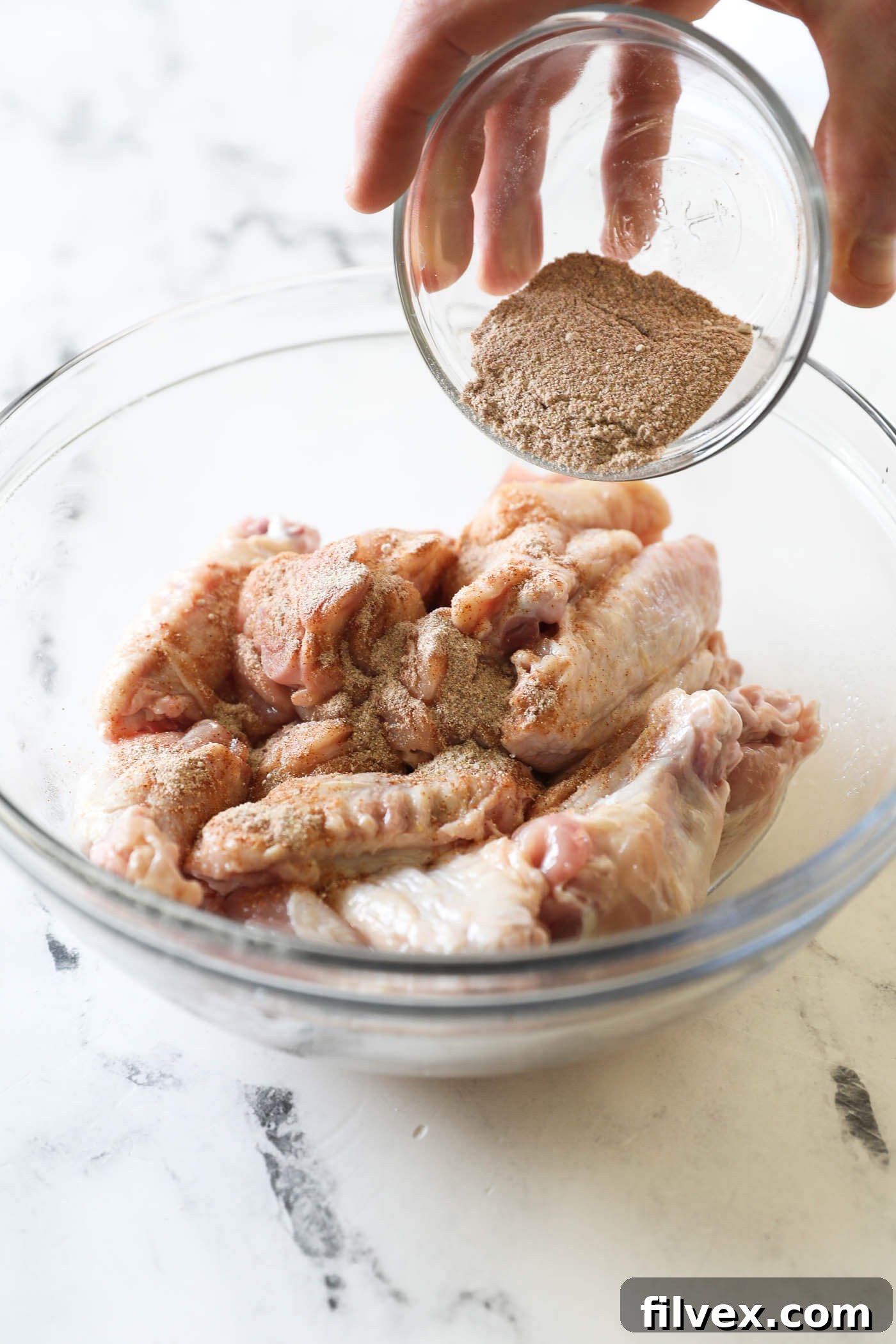 Pour the seasoning mix all over the wings.