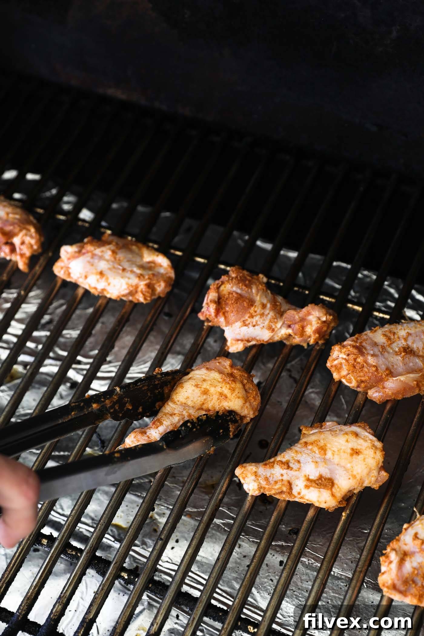 Transfer wings to the grill/smoker and smoke for 30 minutes.