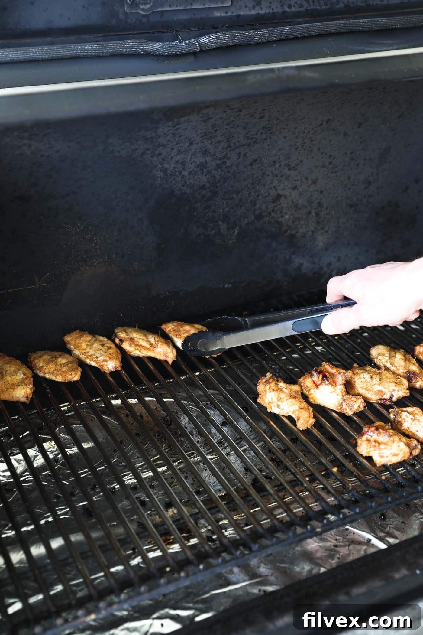 If your pellet grill has a hot spot, move the wings to that spot after turning the heat up. I’ve found that this is the very back of the grill for Traeger pellet grills.