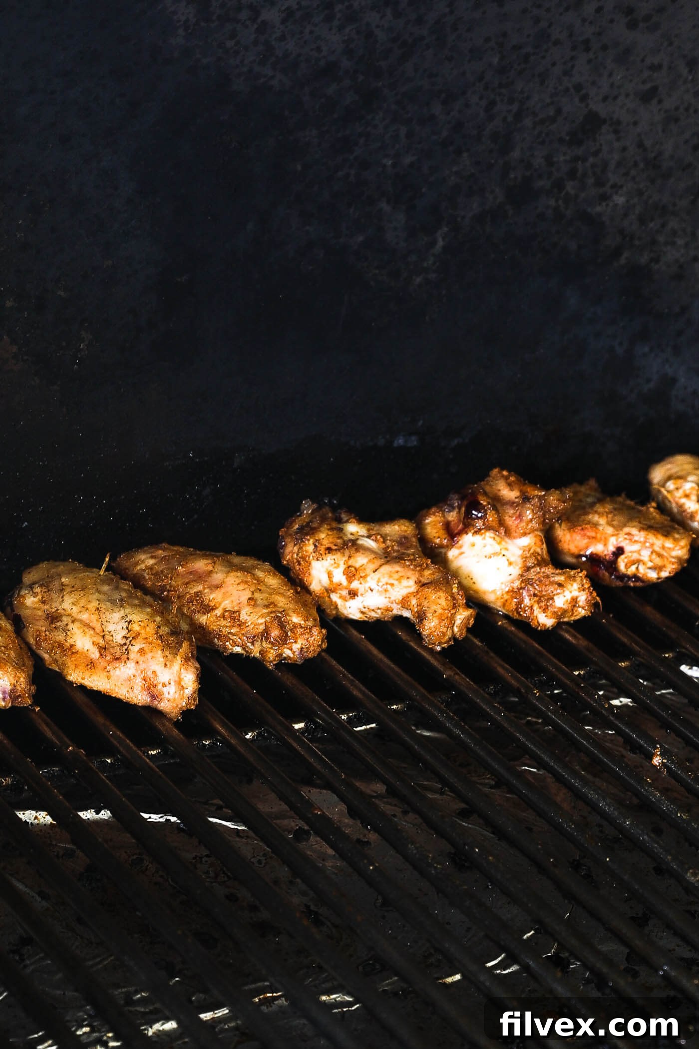 Cook the wings for another 25-30 minutes (from when you turned the heat up). Flip wings every 5-6 minutes until fully cooked. Flipping helps to cook evenly and prevent burning.