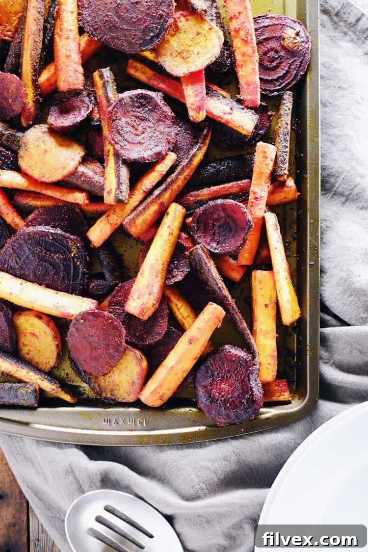 Vibrant Turmeric Maple Roasted Beets and Carrots, a healthy and easy Paleo and Gluten-Free side dish for any meal.
