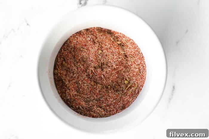 Overhead image of a ramekin with a homemade cajun seasoning mix in it.