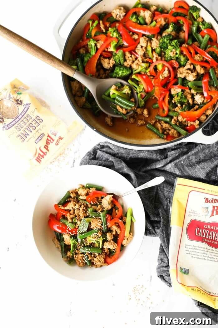 Overhead image of cooked ground turkey stir fry with vegetables in a pan