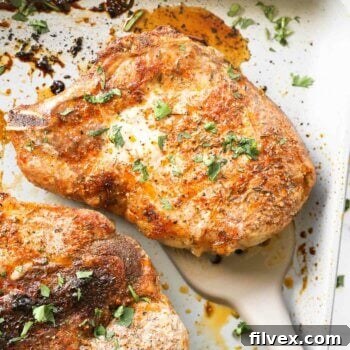 Overhead image of cooked oven baked bone in pork chops