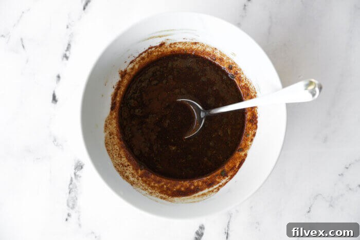 Chicken fajita sauce in a bowl with spoon