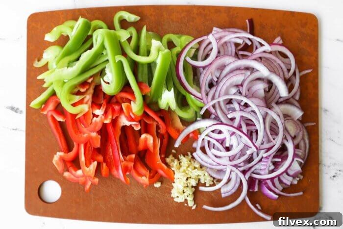 Chopped green and red bell pepper, purple onion and garlic