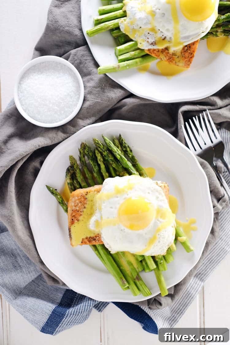Roasted salmon and asparagus with hollandaise sauce: A versatile and healthy dish perfect for breakfast, brunch, lunch, or dinner. Gluten-free, Paleo, Whole30 recipe by realsimplegood.com