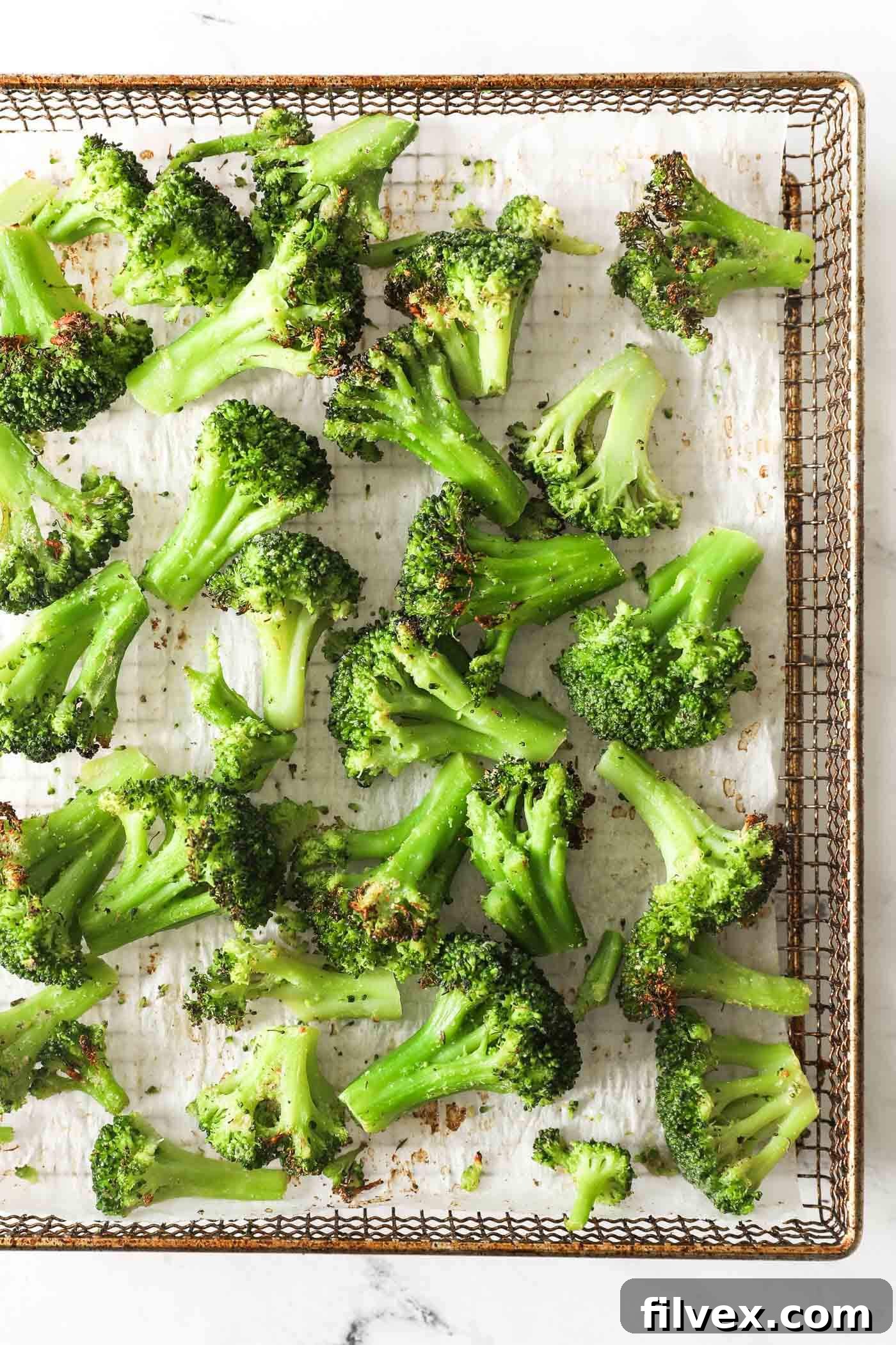 Close-up of perfectly seasoned crisp-tender air fryer frozen broccoli florets in a bowl, ready to serve.