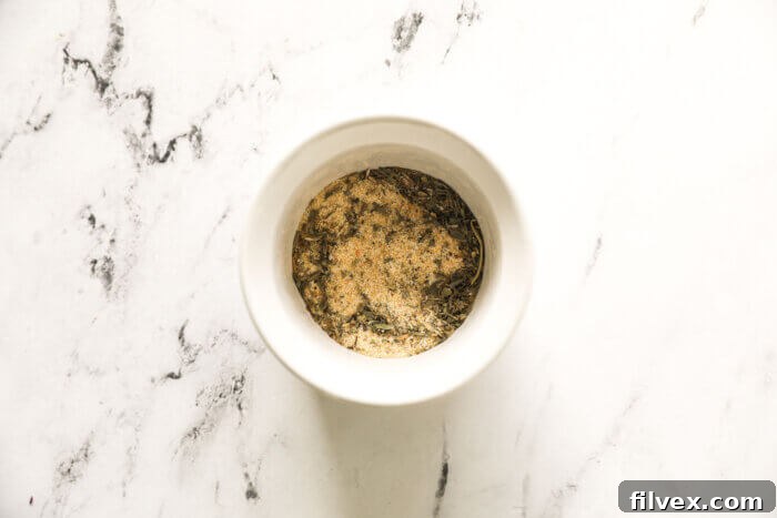 Overhead image of a small bowl containing the perfectly mixed broccoli seasoning blend, ready for use.