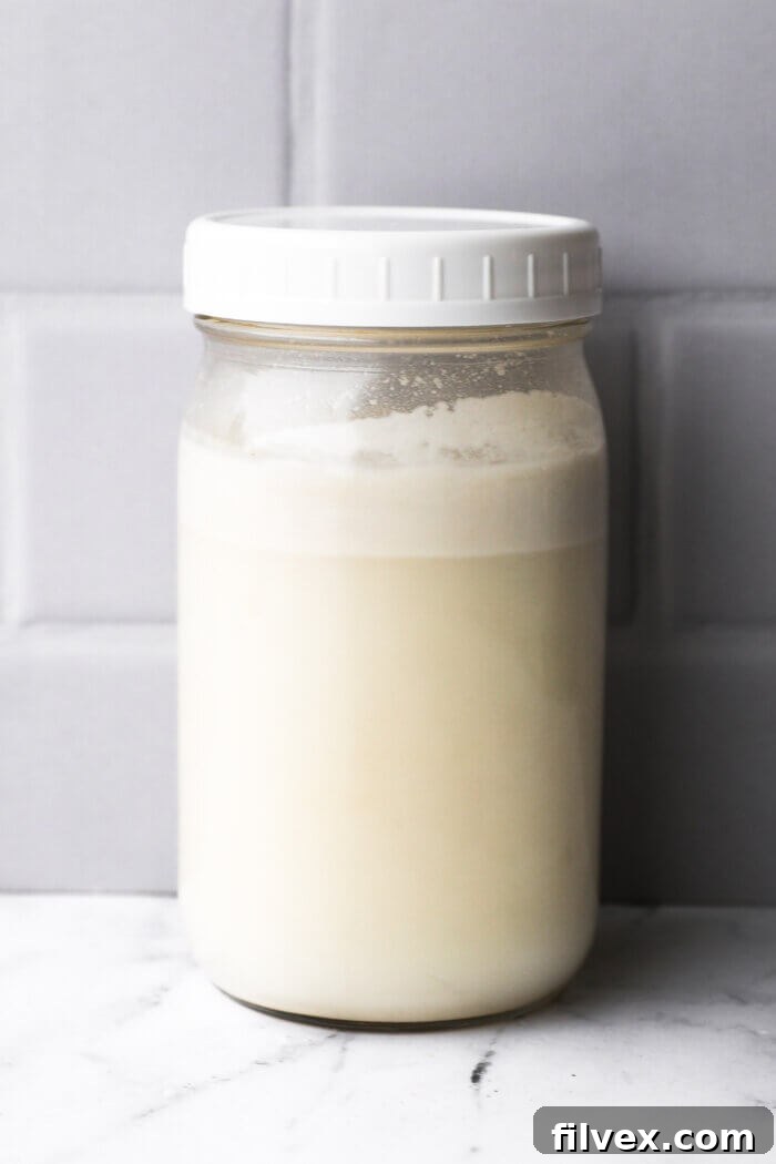 Coconut milk in a mason jar after the fat has separated to the top of the jar.