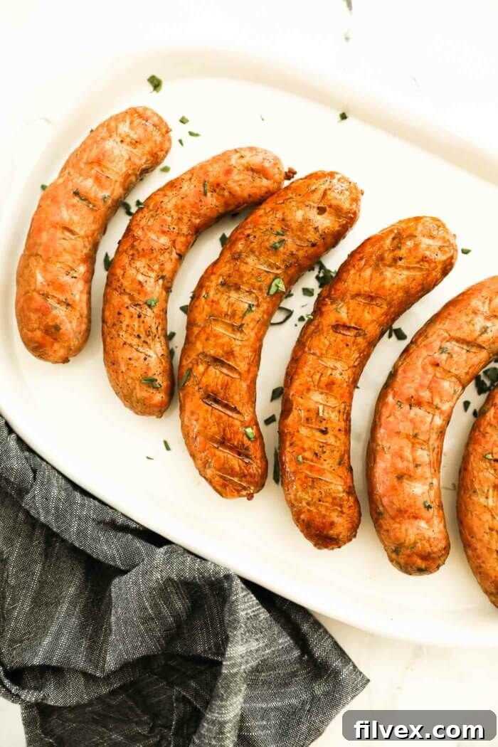 Perfectly smoked sausage links, golden brown and juicy, ready to be served from the smoker.