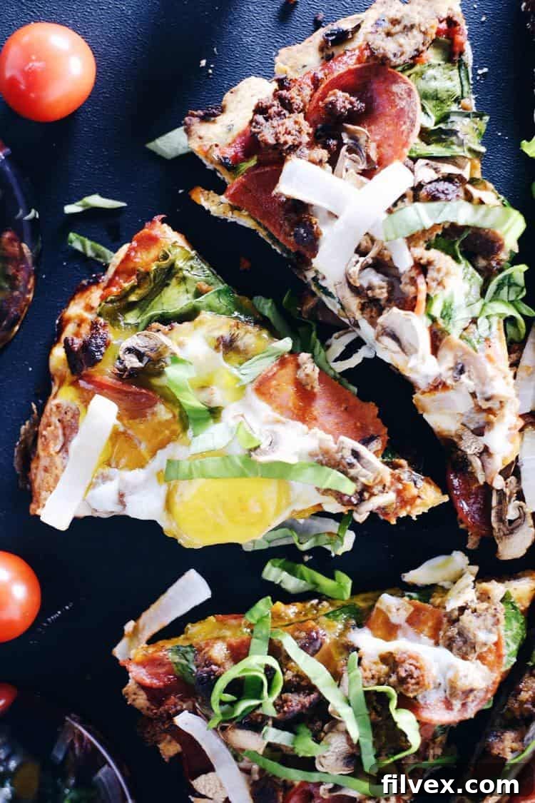 Our Paleo Breakfast Pizza is loaded with delicious and wholesome ingredients: sausage, pepperoni, mushrooms, onion, spinach, and gooey eggs. A gluten-free, refined sugar-free, and dairy-free delight from realsimplegood.com
