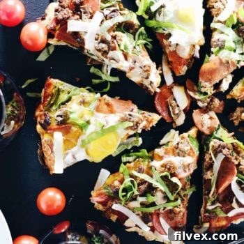 Paleo Breakfast Pizza with eggs, sausage, and veggies