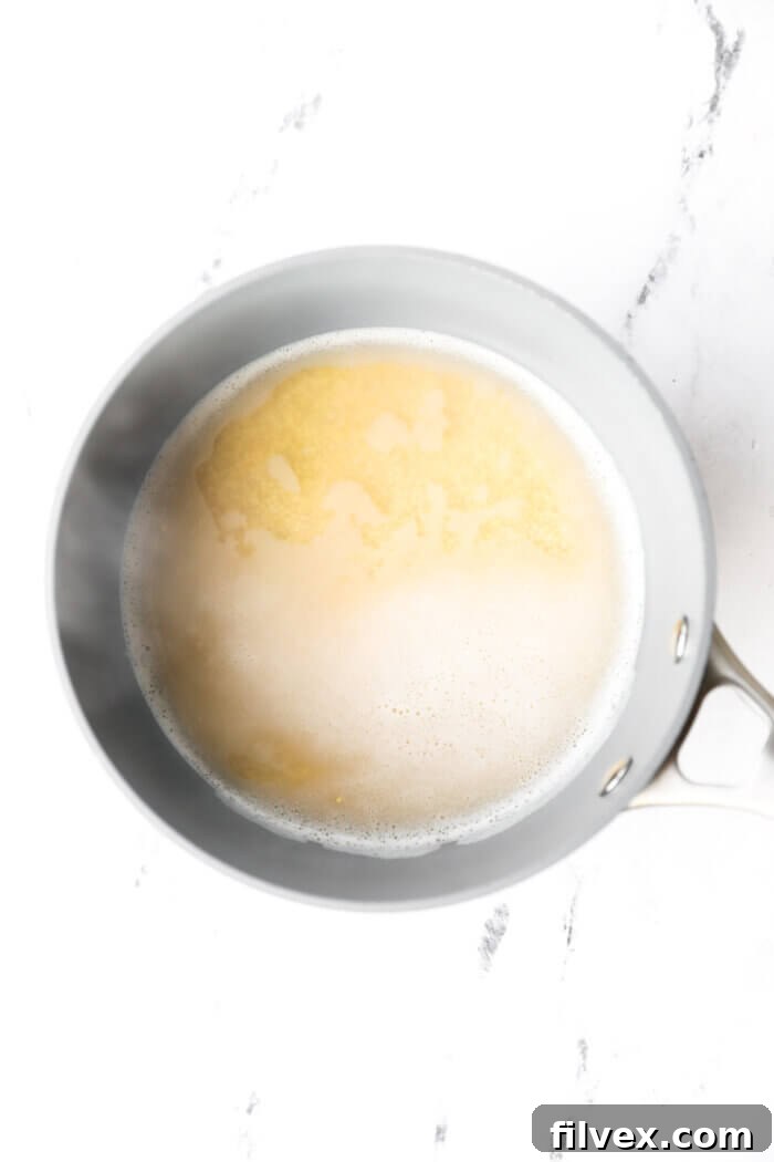 Millet and water in a saucepan after bringing to a boil.