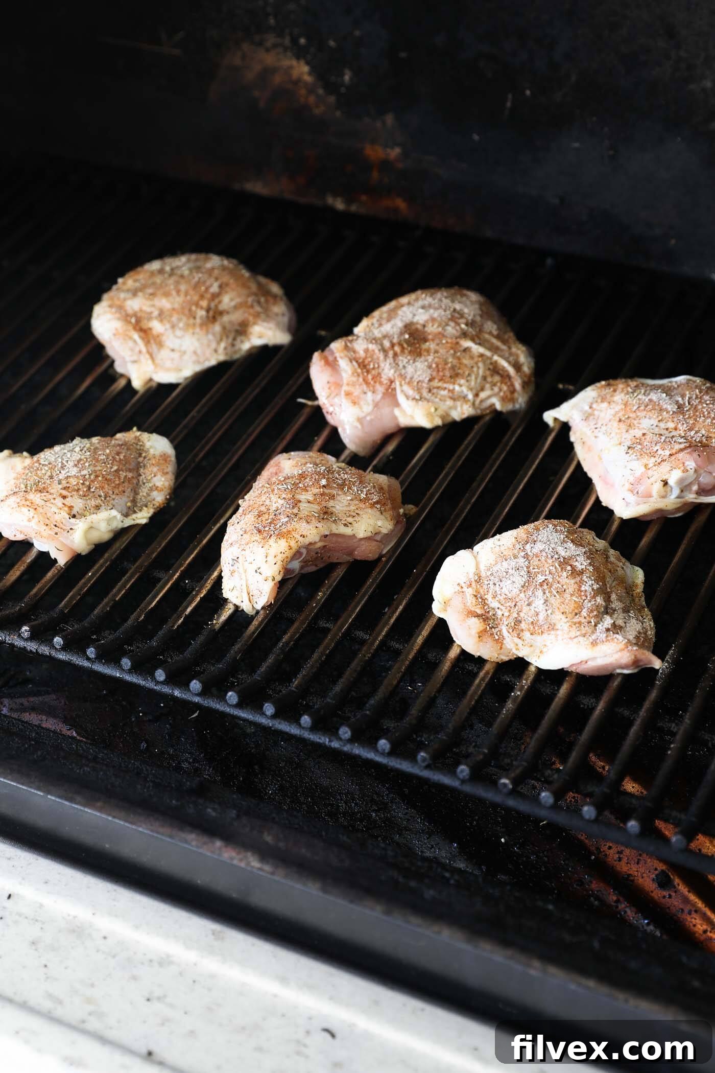 Smoking chicken thighs at 225°F until 165°F internal temperature is reached