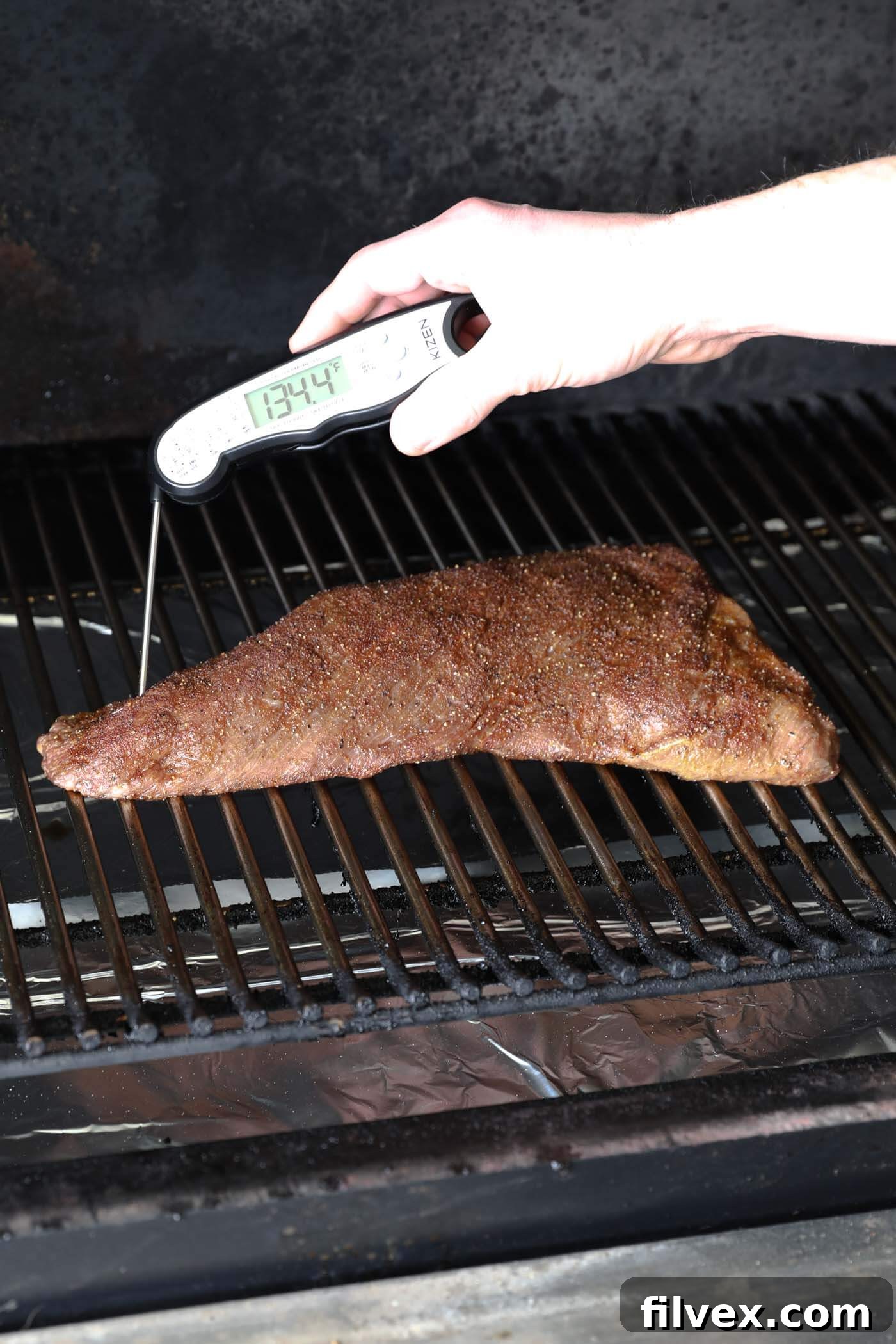 Close-up of a raw tri-tip showing muscle grain direction.