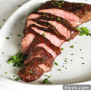 Close up angle image of smoked tri-tip on a platter