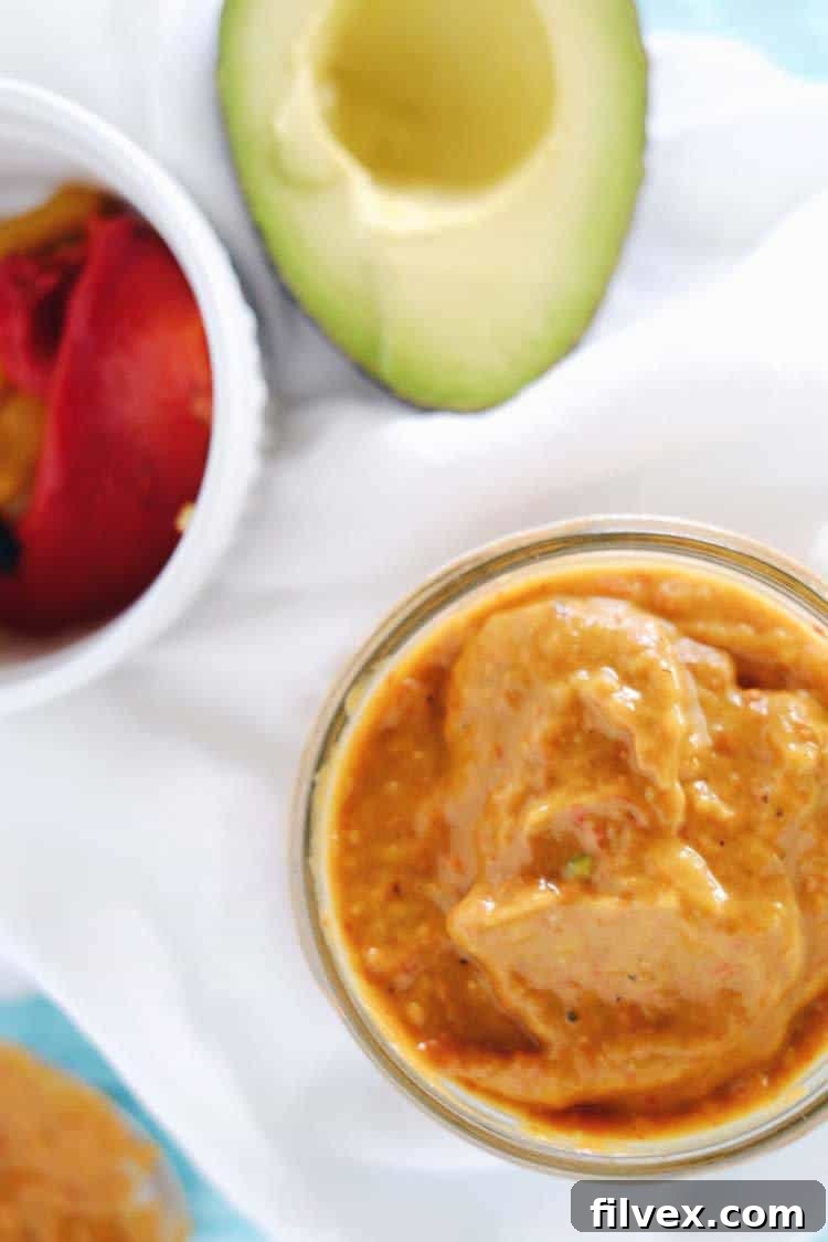 This paleo chicken bowl has simple, wholesome ingredients and the most delicious roasted red pepper sauce. Clean and Whole30 with only eight ingredients, you can prepare it in under 30 minutes. Paleo, Whole30, Gluten-Free + Dairy-Free. | realsimplegood.com