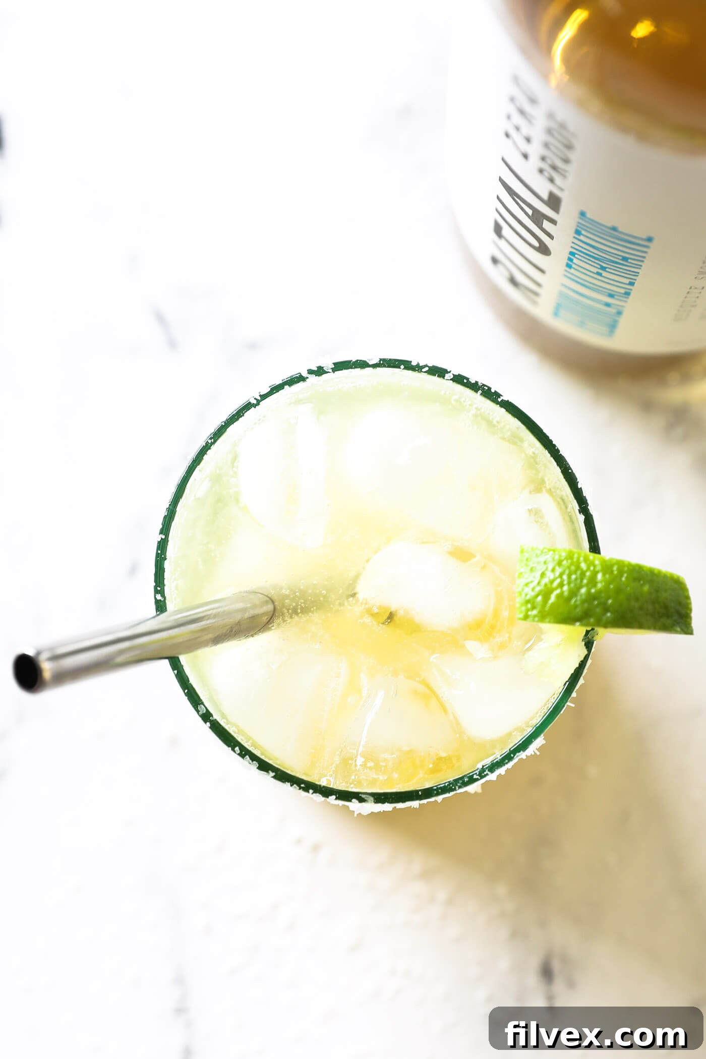 A close-up shot of a refreshing virgin margarita with lime and salt.