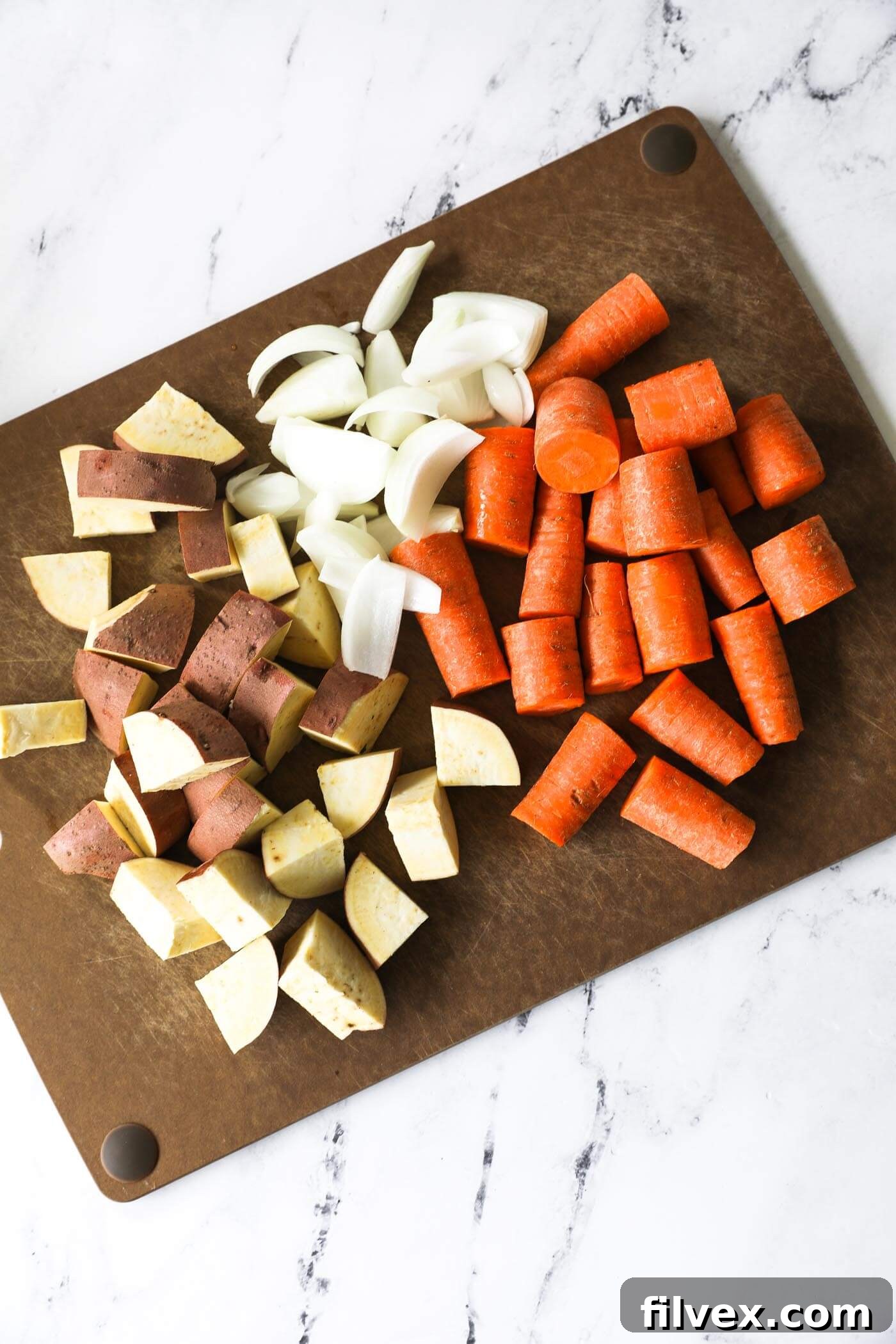 Freshly chopped onion, carrots, and potatoes for the pot roast