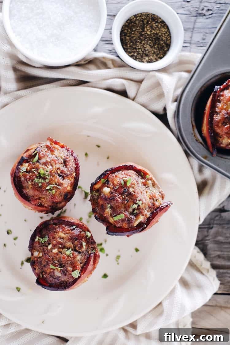 Savory mini bacon wrapped meatloaves made with ground beef and Italian sausage, perfect for Paleo, Whole30, and Keto diets.