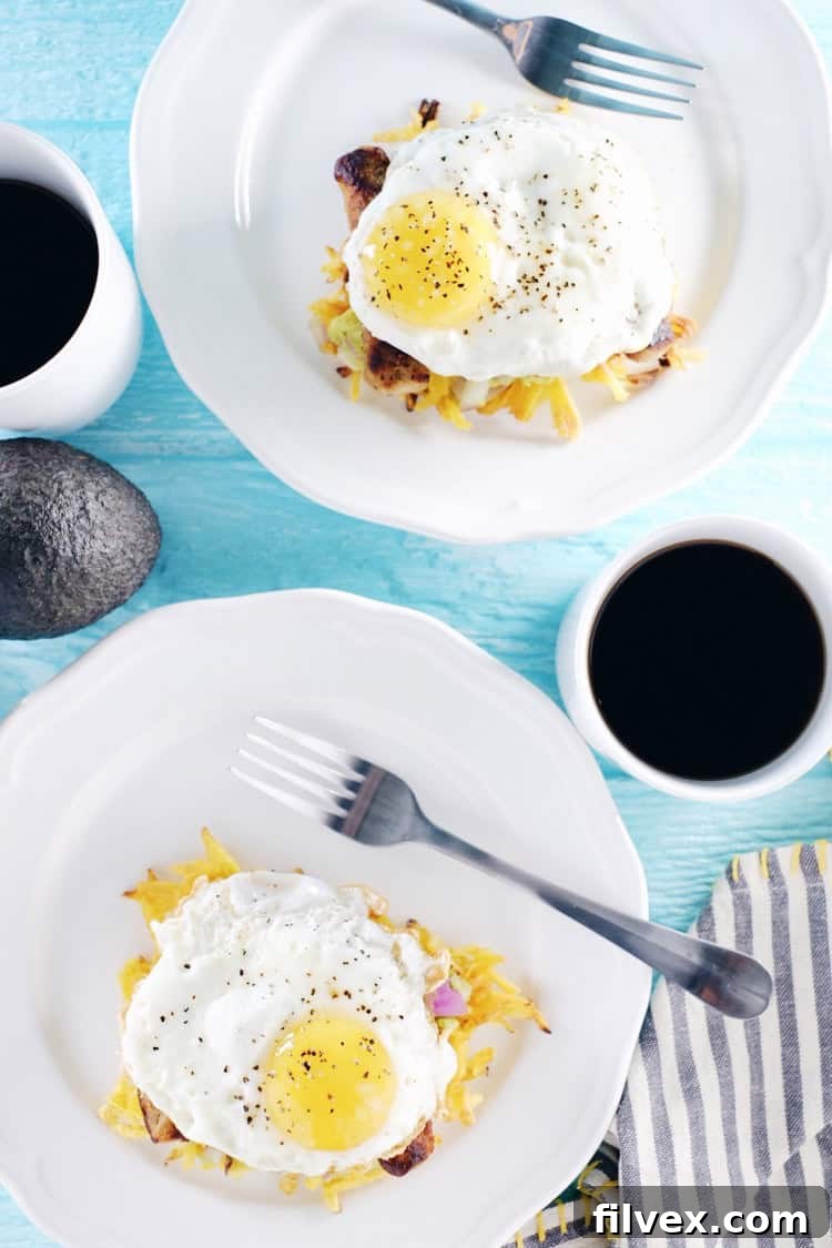 These paleo breakfast stacks are an easy to make favorite. A Whole30 breakfast with plantain hash browns, simple guacamole, sausage and eggs! Paleo, Whole30, Gluten-Free + Dairy-Free. | realsimplegood.com