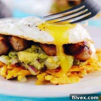 Paleo Breakfast Stacks with Plantain Hash Browns, Guacamole, Sausage, and Eggs
