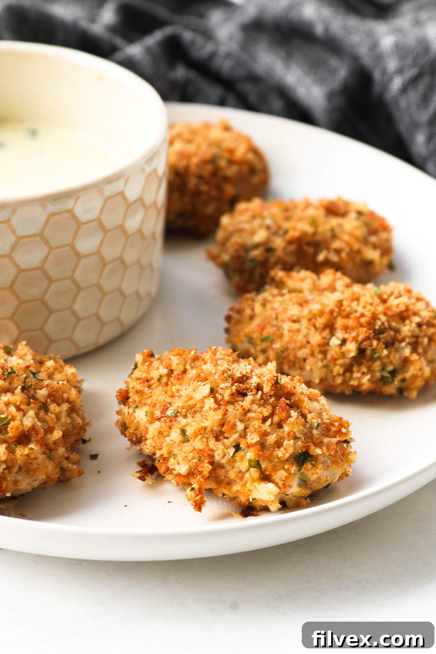 Crispy baked ground chicken nuggets served with dipping sauces
