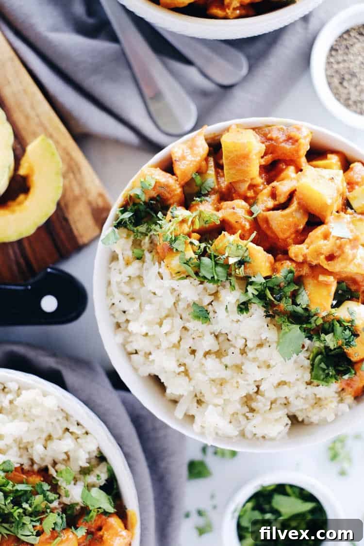 This Paleo + Whole30 red curry squash chicken bowl is so delicious, cozy and comforting. Quick and easy this fall favorite only takes 25 minutes to cook. Paleo, Whole30, Gluten-Free + Dairy-Free. | realsimplegood.com