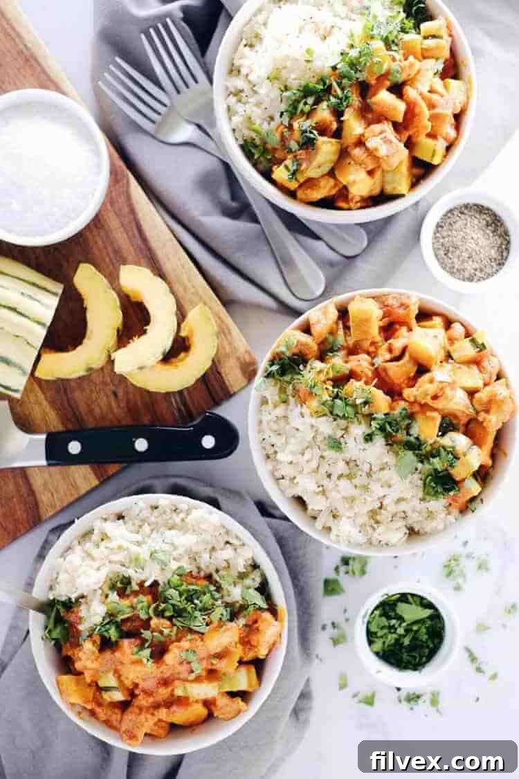 This Paleo + Whole30 red curry squash chicken bowl is so delicious, cozy and comforting. Quick and easy this fall favorite only takes 25 minutes to cook. Paleo, Whole30, Gluten-Free + Dairy-Free. | realsimplegood.com