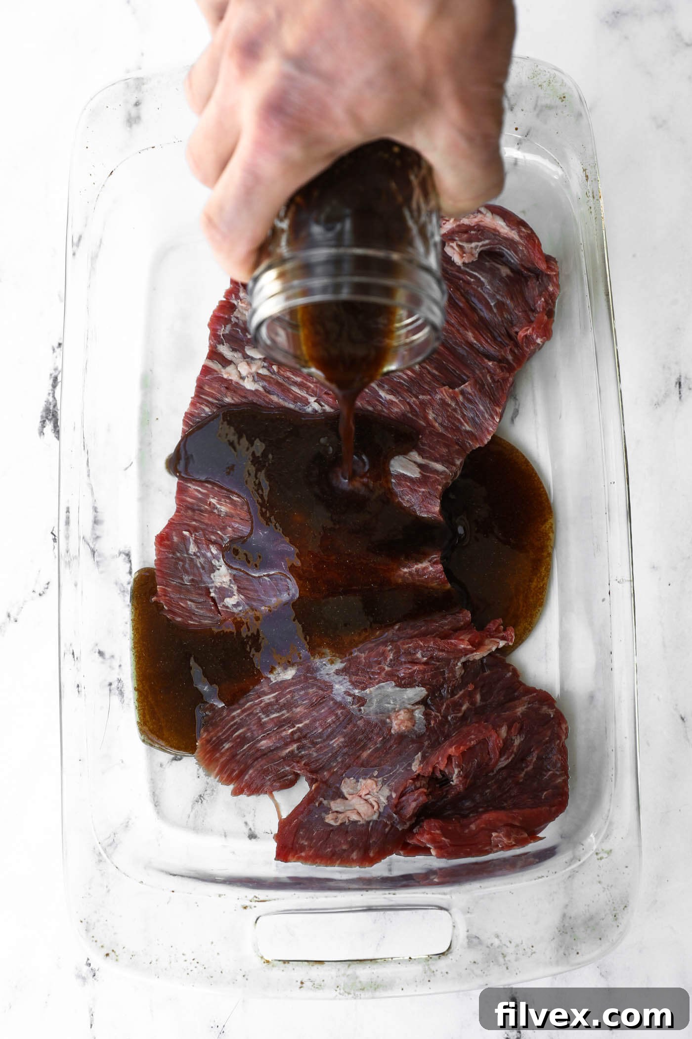 A bowl of fresh balsamic vinegar marinade, ready to use, showcasing its rich, deep color.