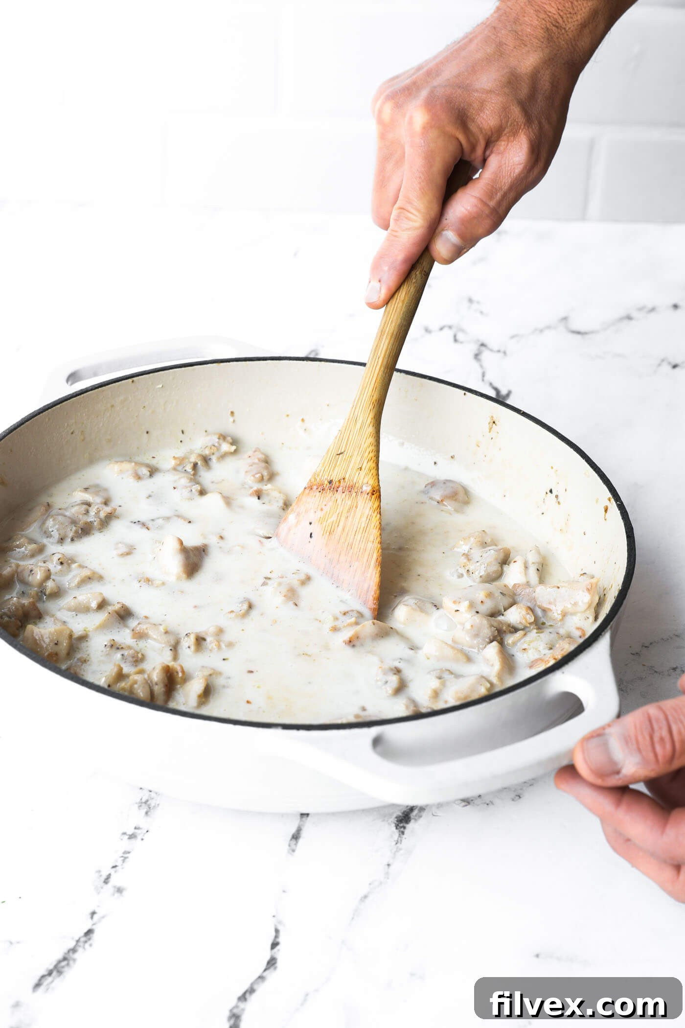 Sauce simmering in a skillet, thickened and deglazed.