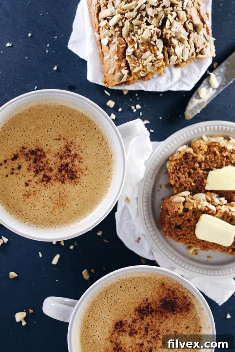 A steaming mug of homemade caffeine-free, Paleo pumpkin chai latte, perfect for fall and winter comfort.