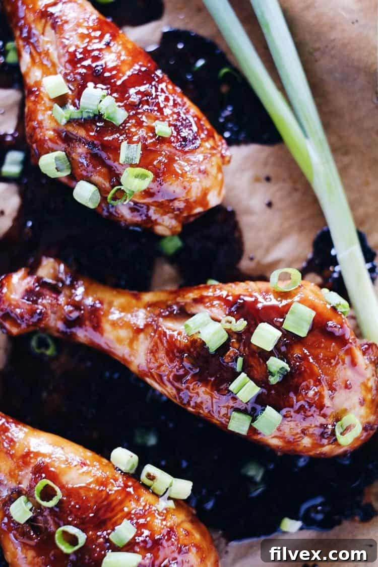 A pan of savory balsamic glazed chicken drumsticks arranged beautifully, ready to be served as a healthy and flavorful main course.