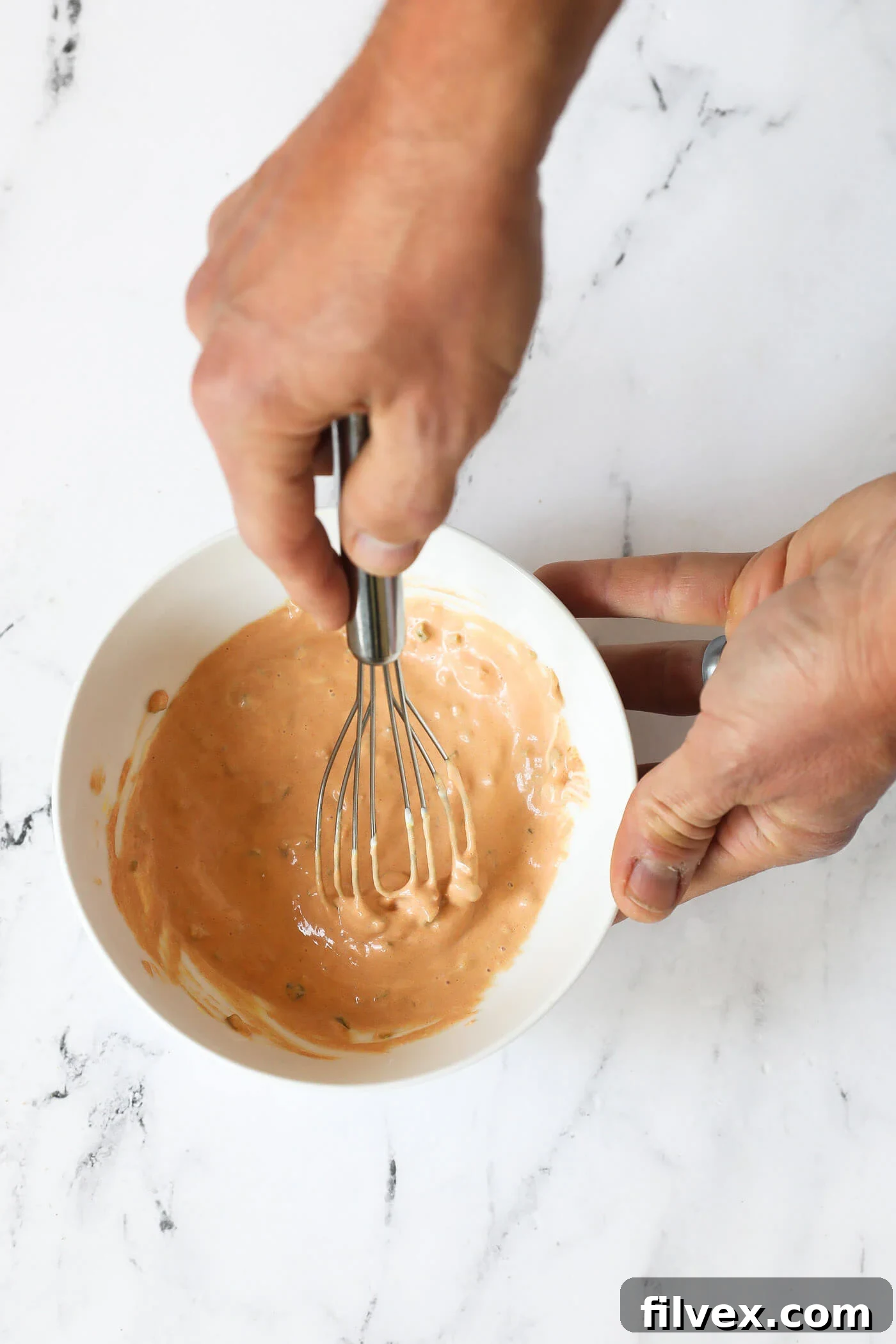 Mixing ingredients for smash burger special sauce