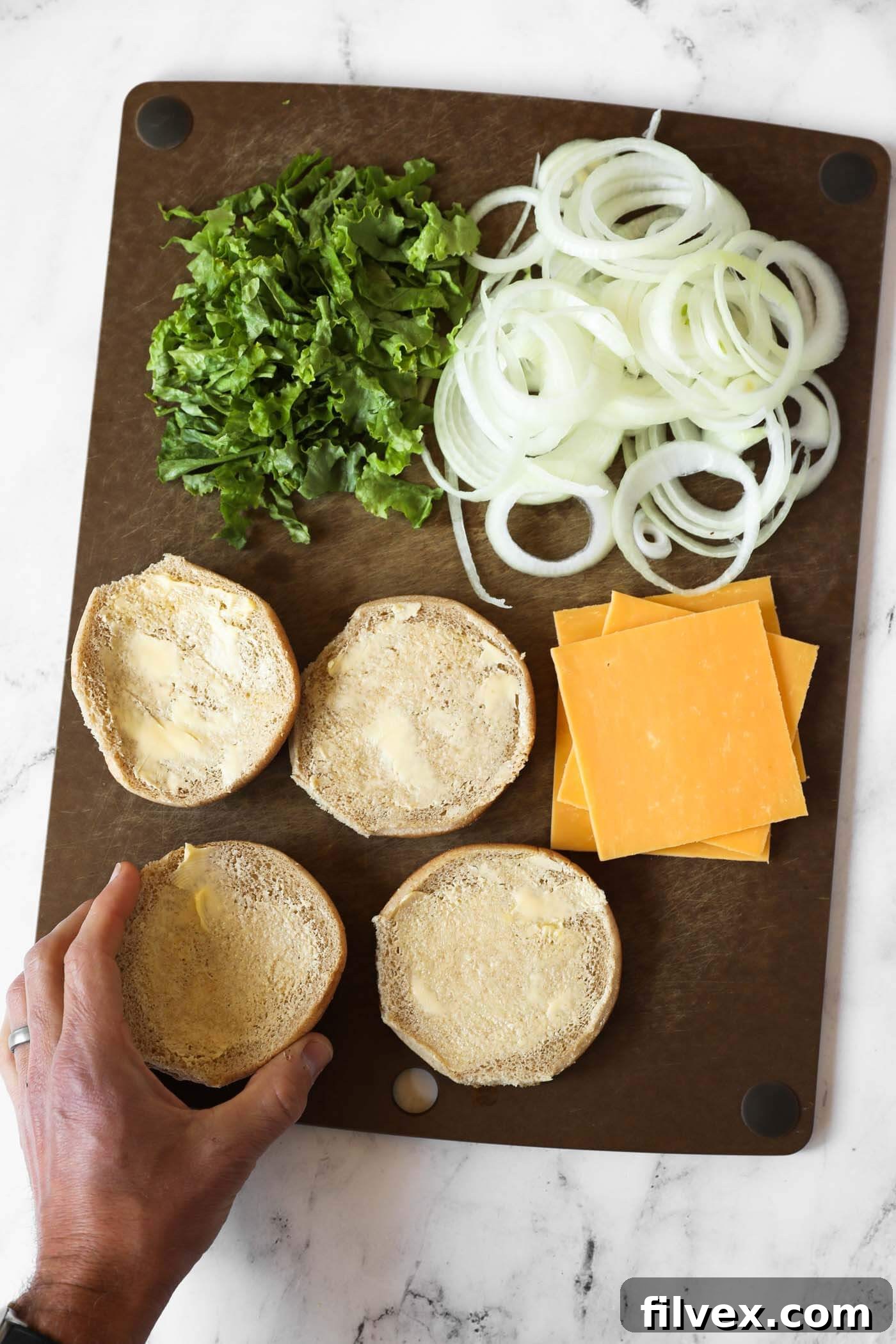 Prepping burger toppings and ingredients