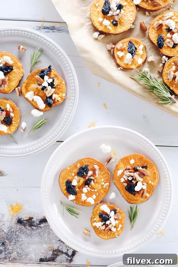 A vibrant platter of roasted sweet potato bites, garnished with optional ingredients like fresh orange zest and a drizzle of maple syrup.