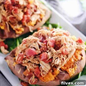 Crockpot Maple Chipotle Chicken Stuffed Sweet Potatoes (Paleo + GF) - A delicious and easy slow cooker meal perfect for chilly evenings.