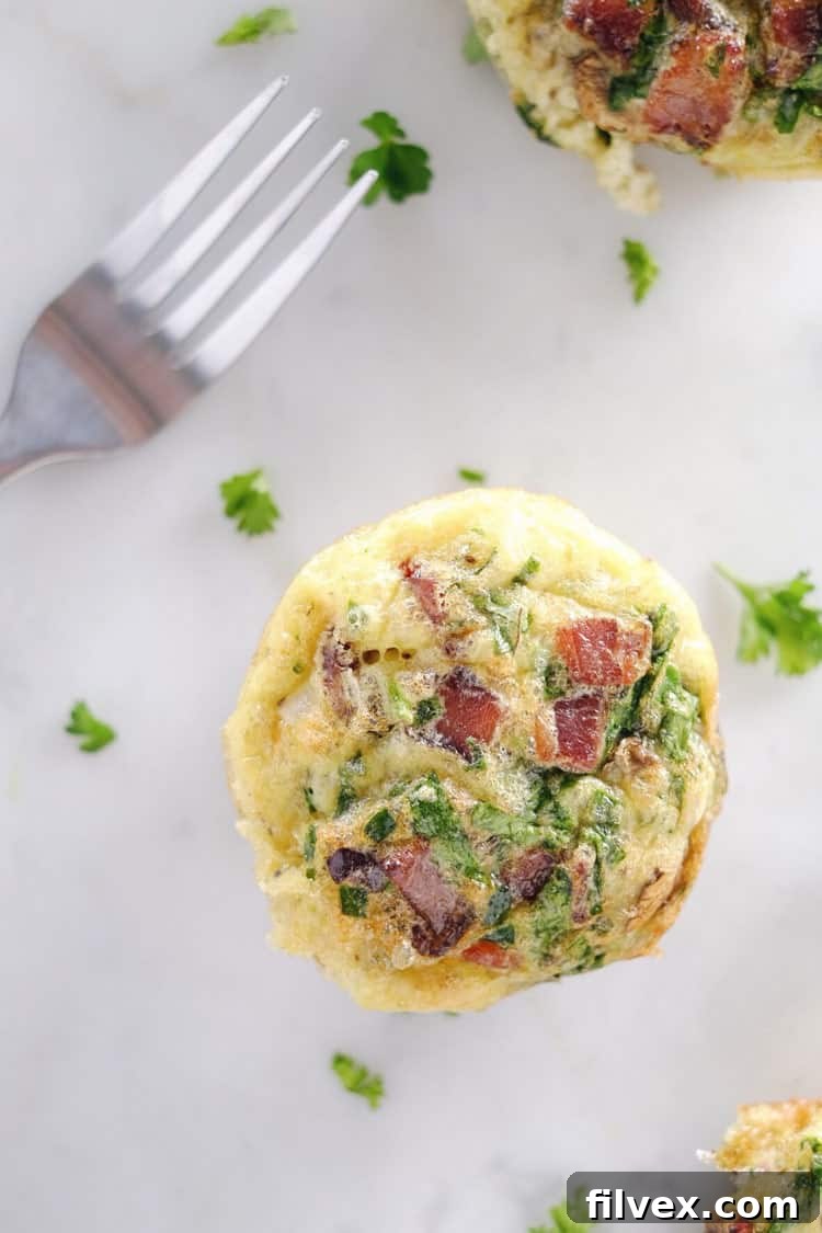 Don't slave in the morning to make a Paleo + Whole30 breakfast. Make these mushroom, spinach and bacon egg muffins ahead of time for easy weekday mornings! Paleo, Whole30, Gluten-Free + Dairy-Free. | realsimplegood.com