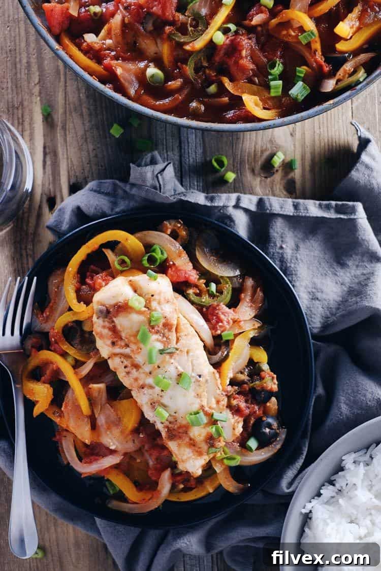 Elevate your fish dinners with this easy and flavorful Veracruz Style Fish Skillet recipe. A quick and healthy meal that's perfect for any occasion.