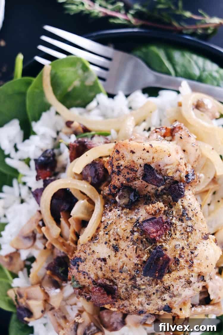 An overhead view of the finished creamy bacon mushroom chicken skillet, showcasing its inviting texture and rich colors.